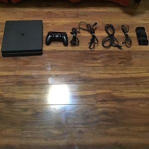 PS4 slim with controller and controller charging station included